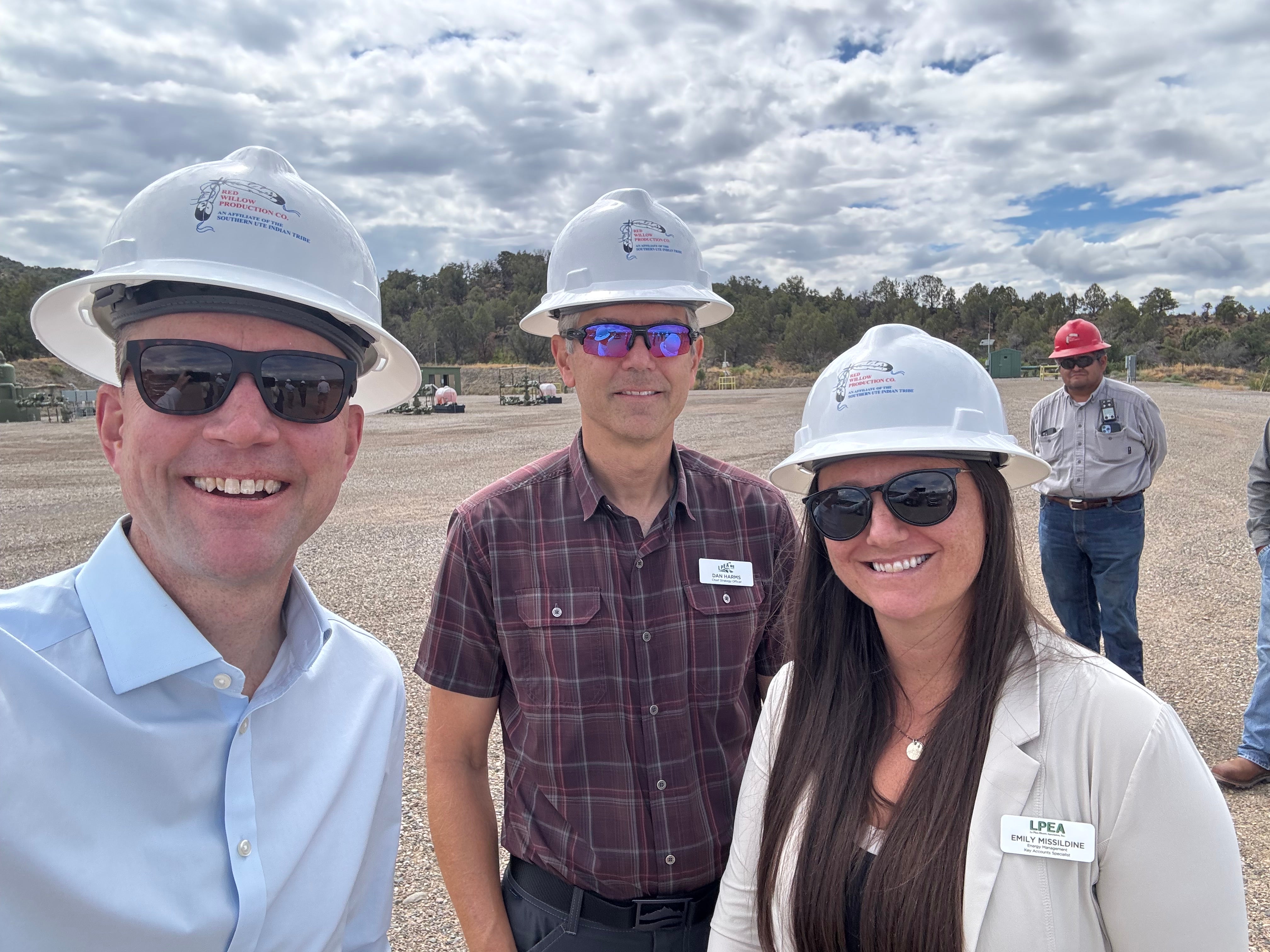 People in hardhats smiling