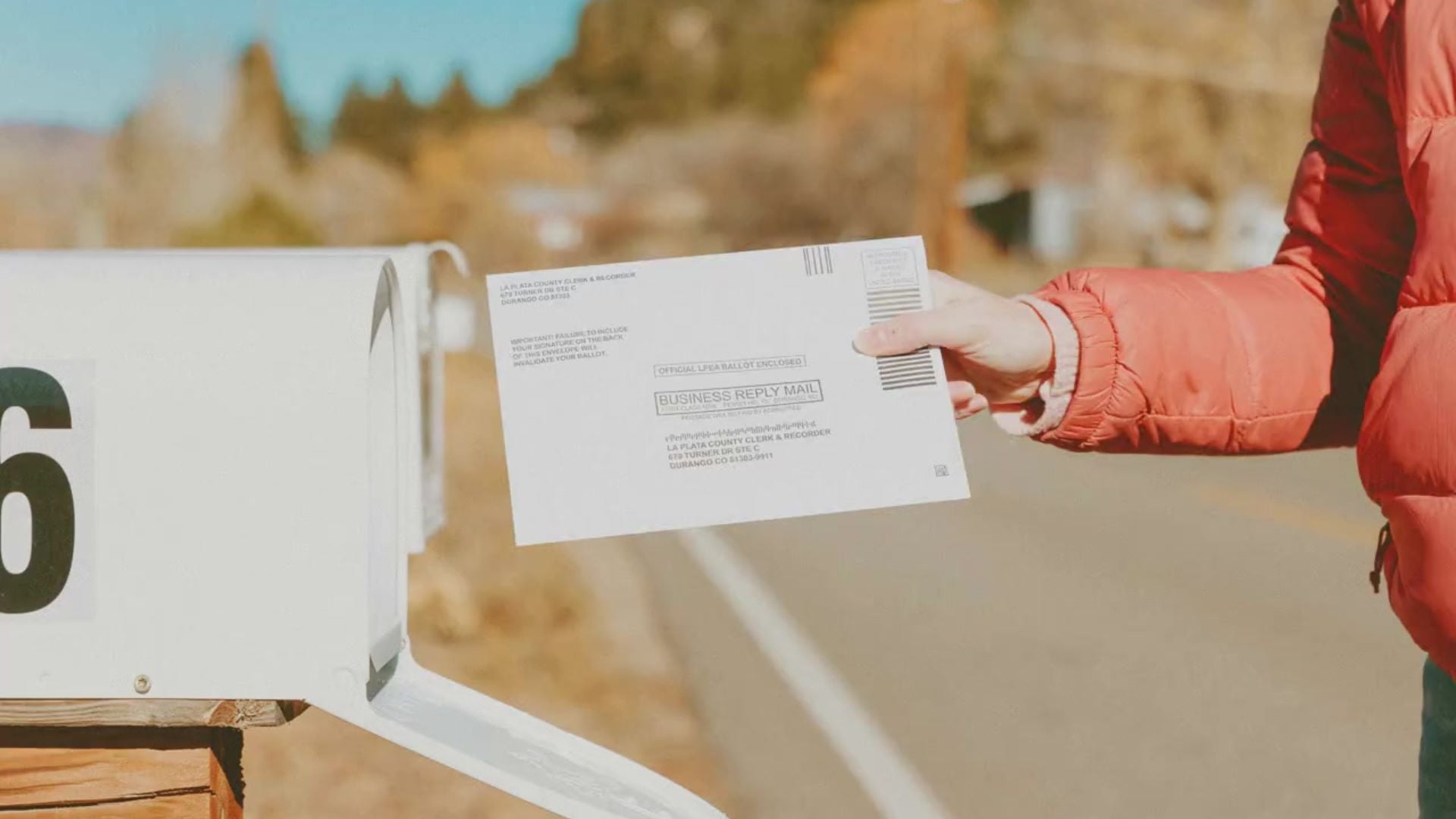 person mailing a ballot