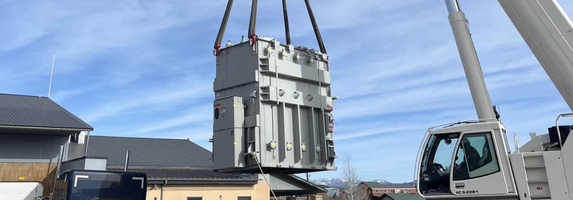 Transformer being lifted by a crane
