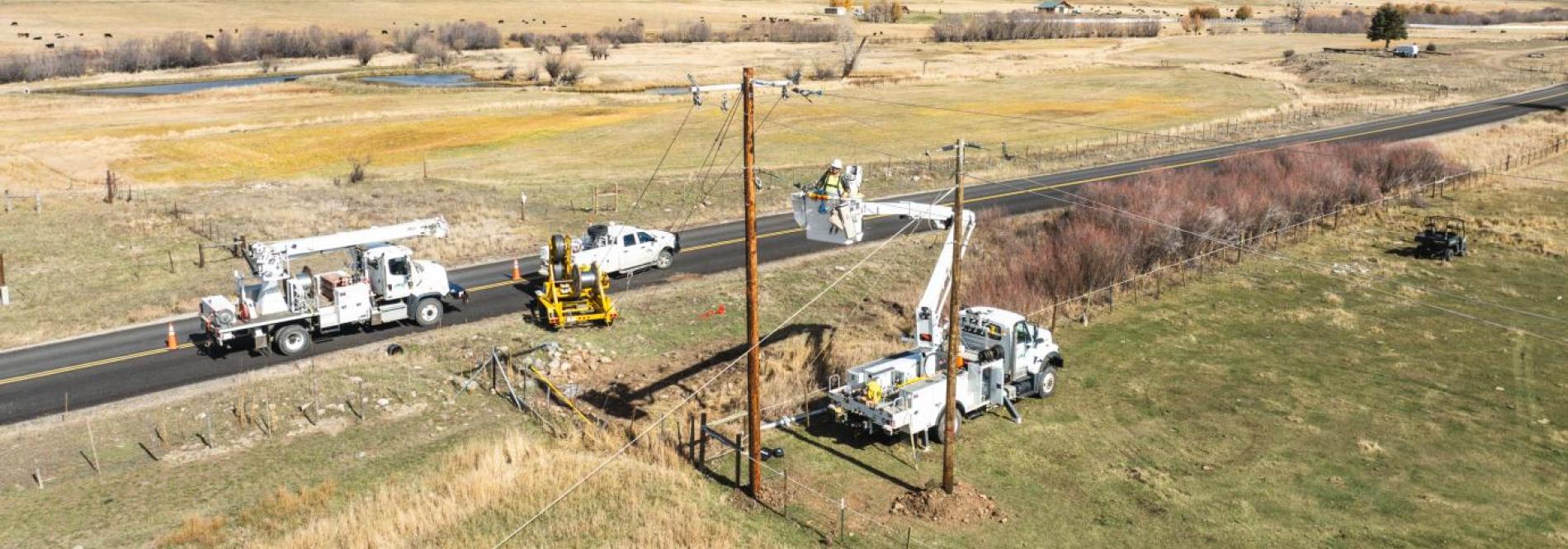 Lineworkers working on a power pole 