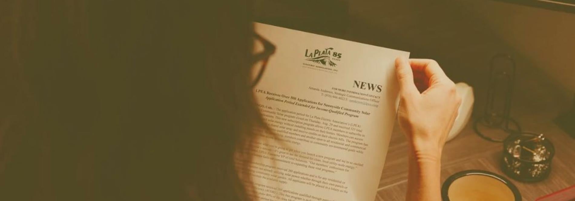 Person reading a news brief