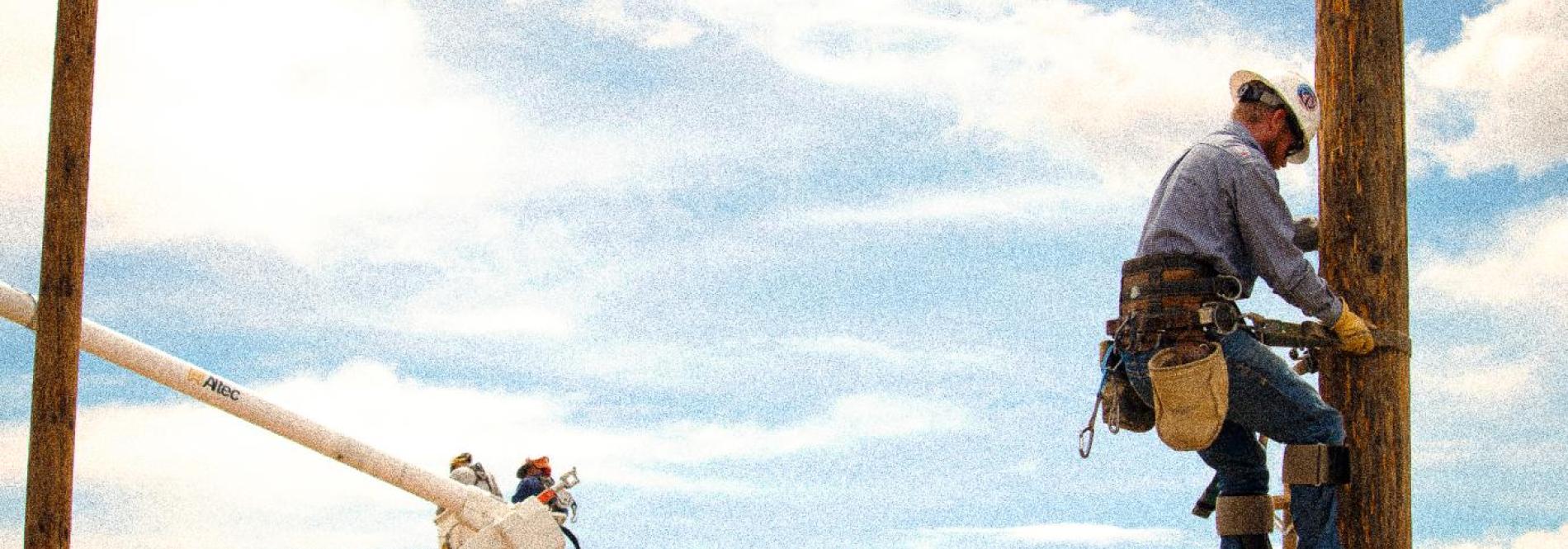 A Lineworker on a Power Pole